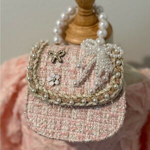 Elegant Pink Tweed Pearl-Embellished Handbag with Crossbody Strap